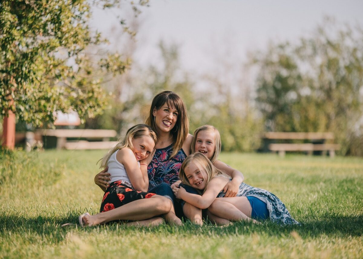 family, nature, mother, daughters, lawn, grass, outdoors, hugs, portrait, caucasian, happy mothers day, mom, mum